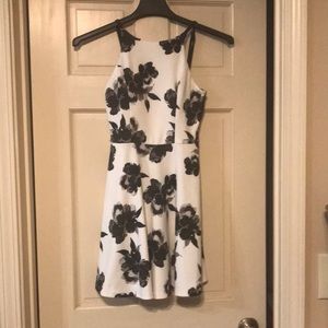 Precious dress!! Black floral ties in back.